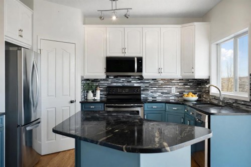 38 Bow Ridge Link Link, Cochrane, AB - Indoor Photo Showing Kitchen With Upgraded Kitchen