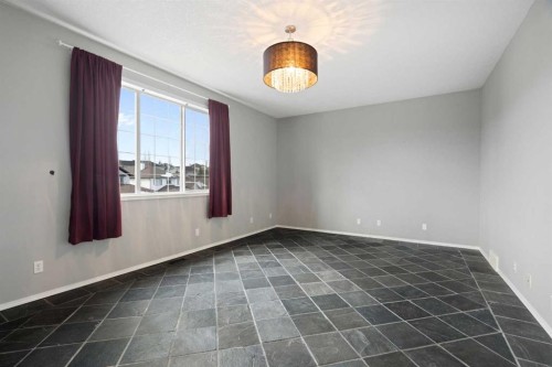 38 Bow Ridge Link Link, Cochrane, AB - Indoor Photo Showing Other Room