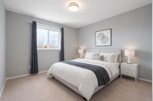 38 Bow Ridge Link Link, Cochrane, AB - Indoor Photo Showing Bedroom