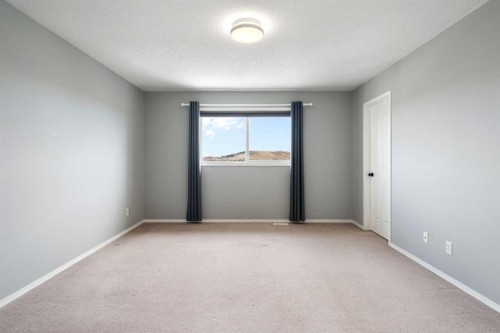 38 Bow Ridge Link Link, Cochrane, AB - Indoor Photo Showing Other Room