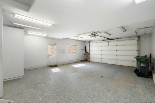 38 Bow Ridge Link Link, Cochrane, AB - Indoor Photo Showing Garage