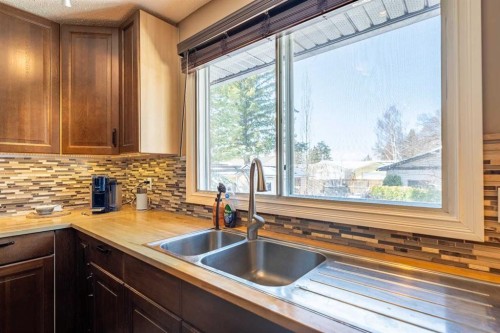 23 Mountain Place, Okotoks, AB - Indoor Photo Showing Kitchen With Double Sink