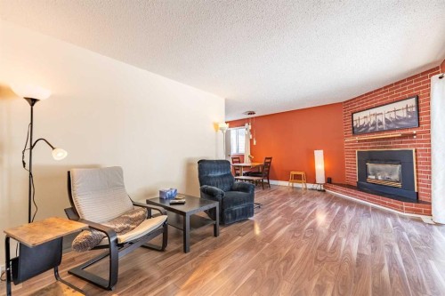 23 Mountain Place, Okotoks, AB - Indoor Photo Showing Living Room With Fireplace