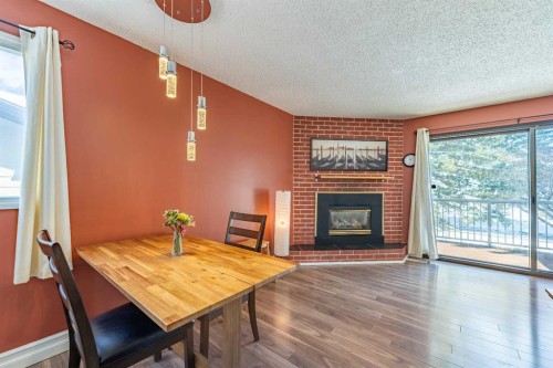 23 Mountain Place, Okotoks, AB - Indoor Photo Showing Other Room With Fireplace