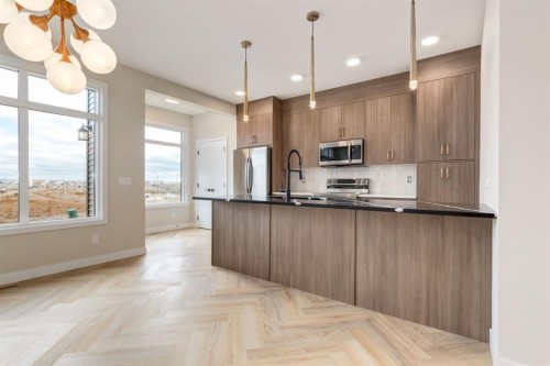 214 Sora Gardens Se, Calgary, AB - Indoor Photo Showing Kitchen With Upgraded Kitchen