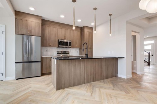 214 Sora Gardens Se, Calgary, AB - Indoor Photo Showing Kitchen With Upgraded Kitchen