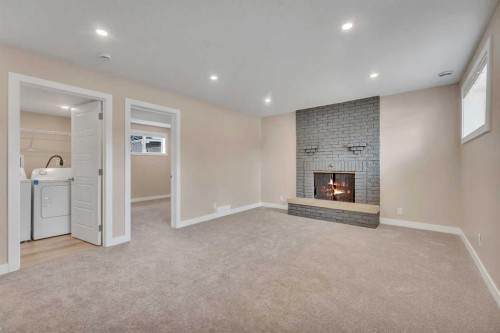 221 Madeira Crescent Ne, Calgary, AB - Indoor With Fireplace