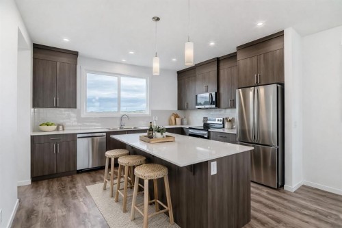 72 Wedderburn Drive, Okotoks, AB - Indoor Photo Showing Kitchen With Stainless Steel Kitchen With Upgraded Kitchen