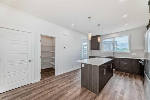 72 Wedderburn Drive, Okotoks, AB - Indoor Photo Showing Kitchen With Upgraded Kitchen