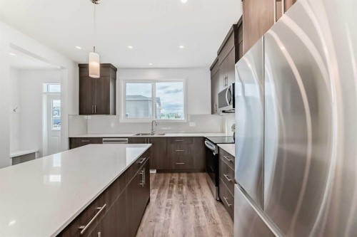 72 Wedderburn Drive, Okotoks, AB - Indoor Photo Showing Kitchen With Stainless Steel Kitchen With Upgraded Kitchen