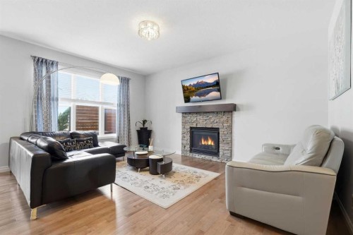 345 Evansglen Drive Nw, Calgary, AB - Indoor Photo Showing Living Room With Fireplace