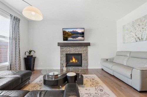 345 Evansglen Drive Nw, Calgary, AB - Indoor Photo Showing Living Room With Fireplace