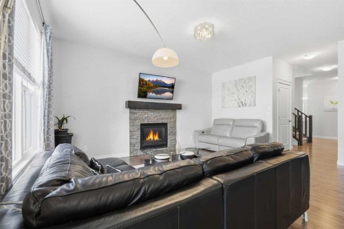 345 Evansglen Drive Nw, Calgary, AB - Indoor Photo Showing Living Room With Fireplace