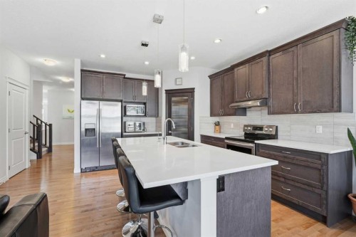 345 Evansglen Drive Nw, Calgary, AB - Indoor Photo Showing Kitchen With Double Sink With Upgraded Kitchen