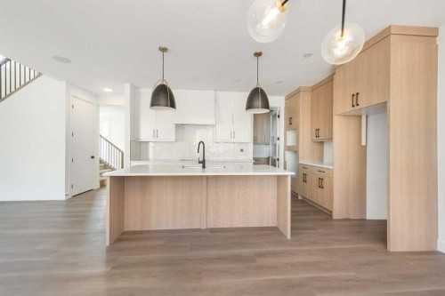 105 Waterford Passage, Chestermere, AB - Indoor Photo Showing Kitchen With Upgraded Kitchen