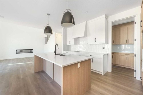105 Waterford Passage, Chestermere, AB - Indoor Photo Showing Kitchen With Double Sink