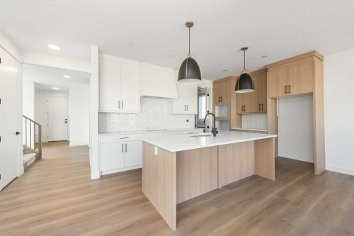 105 Waterford Passage, Chestermere, AB - Indoor Photo Showing Kitchen With Upgraded Kitchen