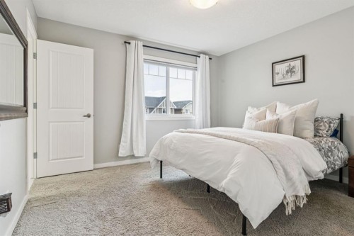 143 Fireside Drive, Cochrane, AB - Indoor Photo Showing Bedroom