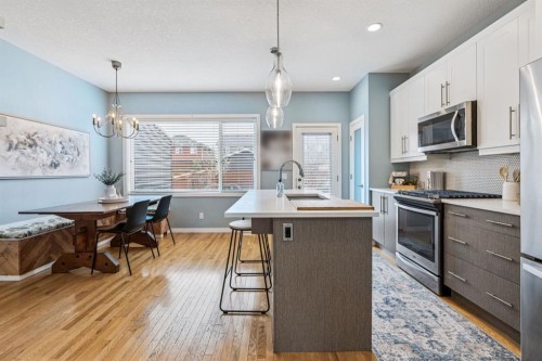 143 Fireside Drive, Cochrane, AB - Indoor Photo Showing Kitchen With Upgraded Kitchen