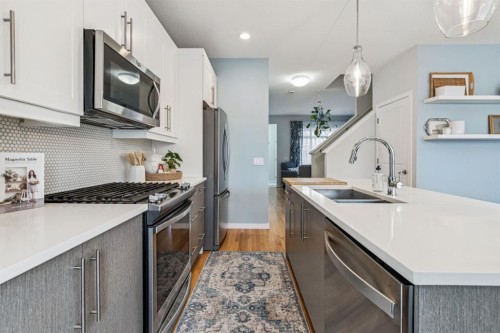 143 Fireside Drive, Cochrane, AB - Indoor Photo Showing Kitchen With Double Sink With Upgraded Kitchen