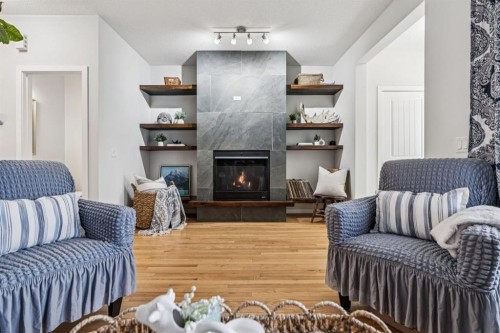143 Fireside Drive, Cochrane, AB - Indoor Photo Showing Living Room With Fireplace