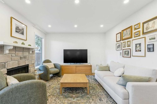 5-140 Point Drive Nw, Calgary, AB - Indoor Photo Showing Living Room With Fireplace
