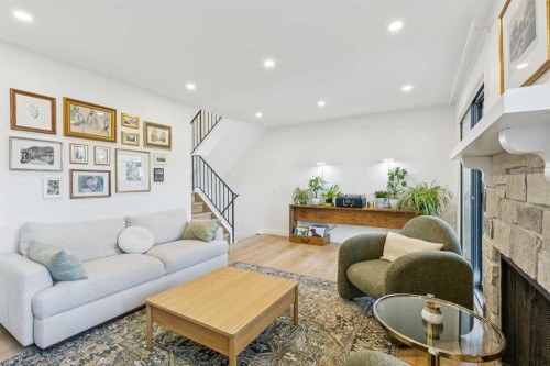 5-140 Point Drive Nw, Calgary, AB - Indoor Photo Showing Living Room With Fireplace
