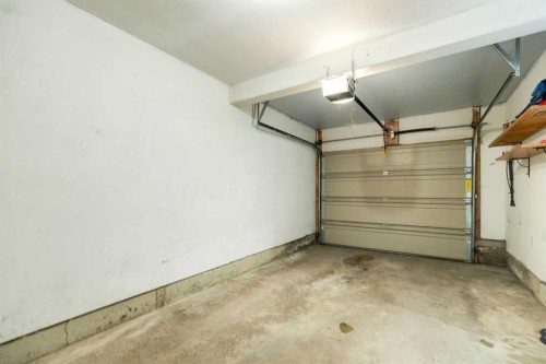 5-140 Point Drive Nw, Calgary, AB - Indoor Photo Showing Garage