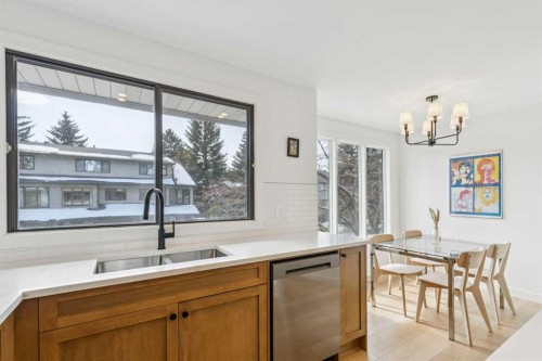 5-140 Point Drive Nw, Calgary, AB - Indoor Photo Showing Kitchen With Double Sink