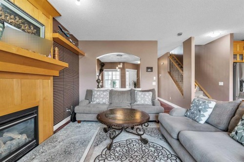 69-39 Strathlea Common Sw, Calgary, AB - Indoor Photo Showing Living Room With Fireplace