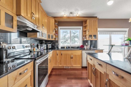 69-39 Strathlea Common Sw, Calgary, AB - Indoor Photo Showing Kitchen With Double Sink