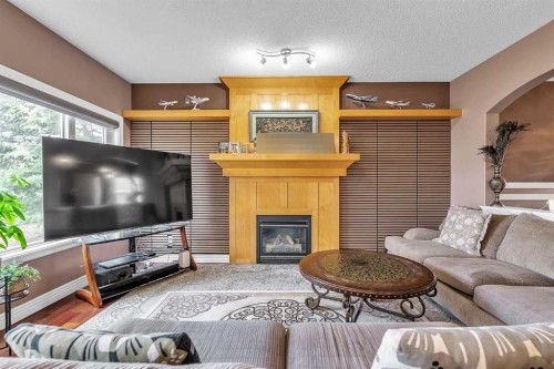 69-39 Strathlea Common Sw, Calgary, AB - Indoor Photo Showing Living Room With Fireplace
