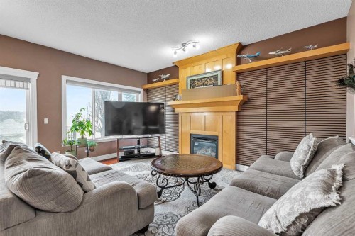 69-39 Strathlea Common Sw, Calgary, AB - Indoor Photo Showing Living Room With Fireplace