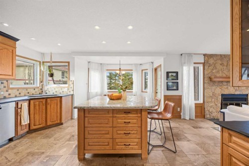 47 Edgeridge Court Nw, Calgary, AB - Indoor Photo Showing Kitchen With Fireplace