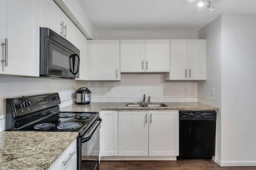 3305-755 Copperpond Boulevard, Calgary, AB - Indoor Photo Showing Kitchen With Double Sink