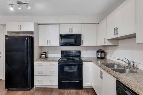 3305-755 Copperpond Boulevard, Calgary, AB - Indoor Photo Showing Kitchen With Double Sink