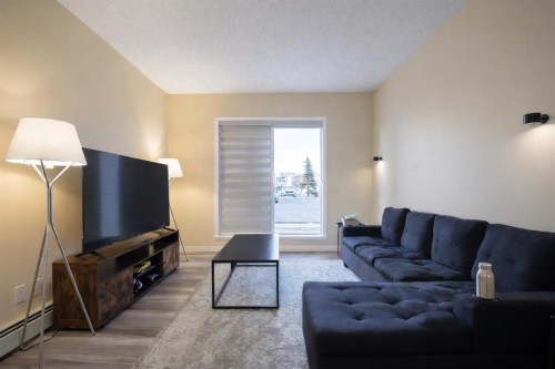 1117-1140 Taradale Drive Ne, Calgary, AB - Indoor Photo Showing Living Room