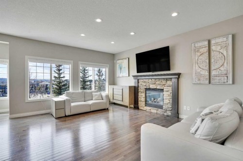 85 Evansborough Way Nw, Calgary, AB - Indoor Photo Showing Living Room With Fireplace