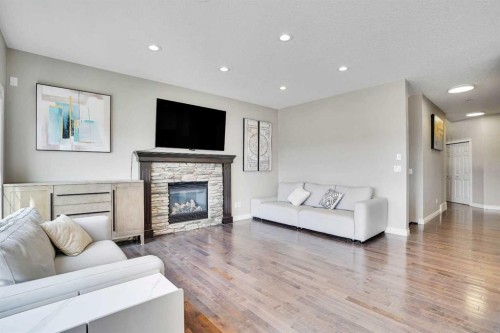 85 Evansborough Way Nw, Calgary, AB - Indoor Photo Showing Living Room With Fireplace