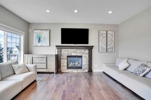 85 Evansborough Way Nw, Calgary, AB - Indoor Photo Showing Living Room With Fireplace