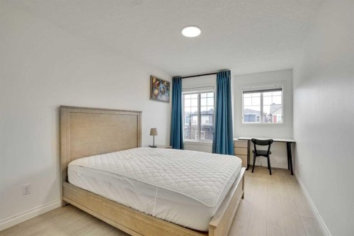 85 Evansborough Way Nw, Calgary, AB - Indoor Photo Showing Bedroom