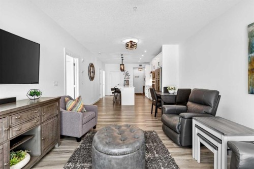 122-400 Auburn Meadows Common Se, Calgary, AB - Indoor Photo Showing Living Room With Fireplace