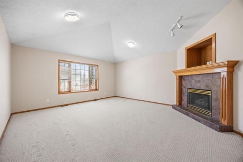 119 Valley Glen Bay Nw, Calgary, AB - Indoor With Fireplace