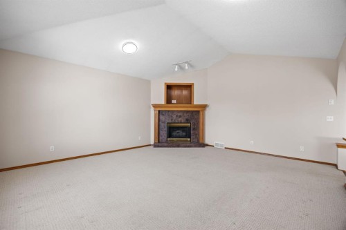 119 Valley Glen Bay Nw, Calgary, AB - Indoor With Fireplace