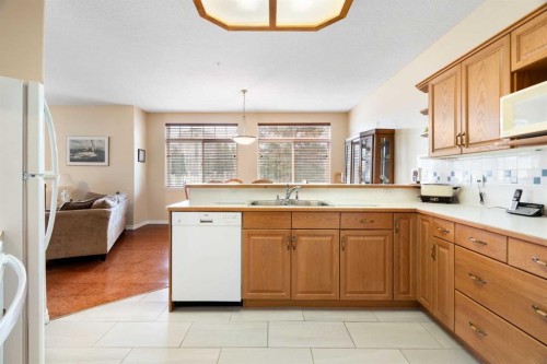 .-2107 Patterson View Sw, Calgary, AB - Indoor Photo Showing Kitchen With Double Sink