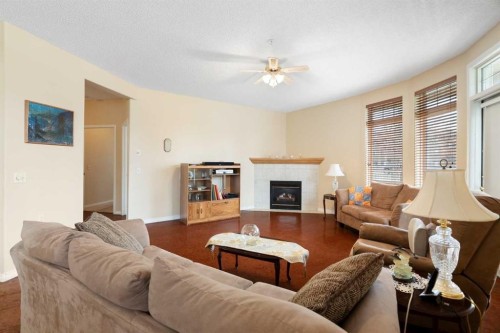 .-2107 Patterson View Sw, Calgary, AB - Indoor Photo Showing Living Room With Fireplace