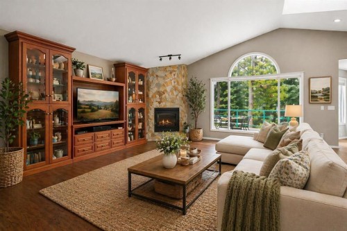 39 Highlands Terrace, Bragg Creek, AB - Indoor Photo Showing Living Room With Fireplace
