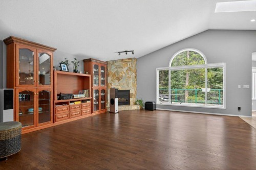 39 Highlands Terrace, Bragg Creek, AB - Indoor Photo Showing Living Room With Fireplace