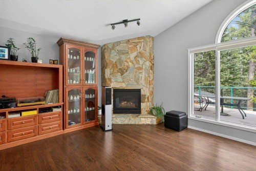 39 Highlands Terrace, Bragg Creek, AB - Indoor Photo Showing Other Room With Fireplace