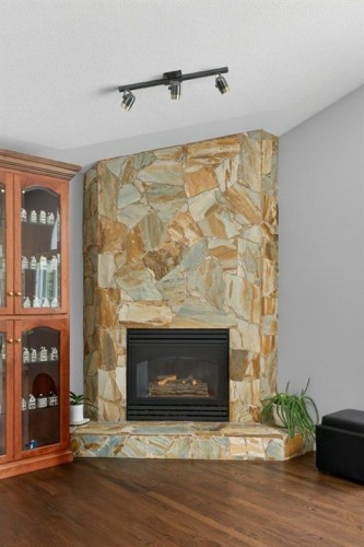 39 Highlands Terrace, Bragg Creek, AB - Indoor Photo Showing Living Room With Fireplace